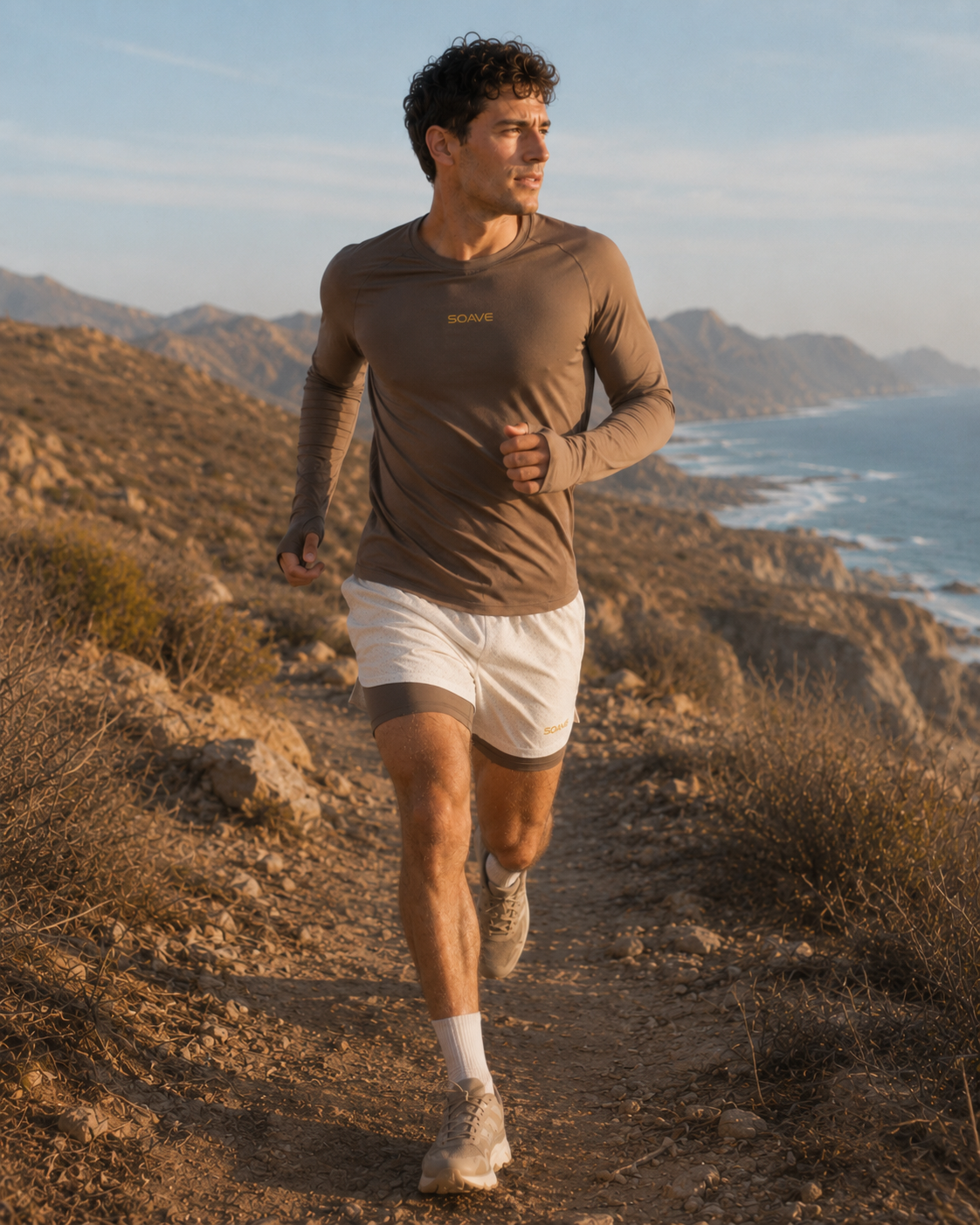 Runner in motion wearing SOAVE Coastline LS on a desert coastal trail